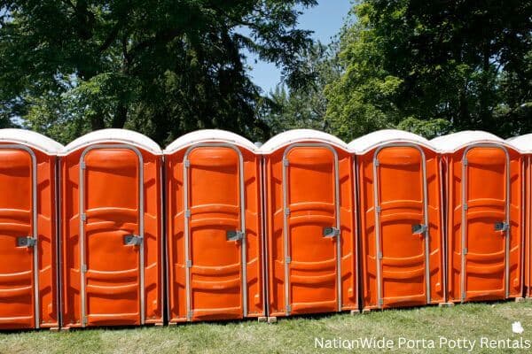 a lineup of clean and well-maintained portable loos for workers in Oaklyn, NJ